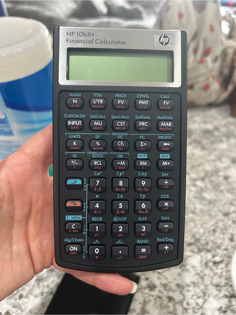 HP Financial Calculator in Black with Teal and Coral Accents